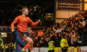 Dundee United's Sam Dalby jumps for joy after bagging the winner.