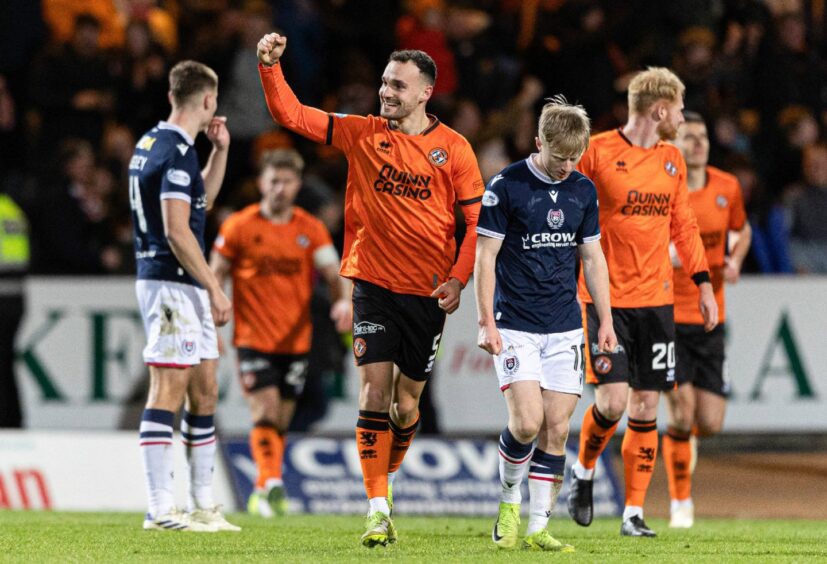 Dundee United enjoy their win at Dens Park.