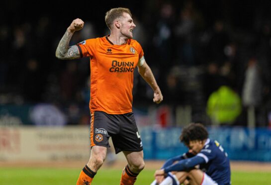 Kevin Holt roars with delight after teeing up United's winner.