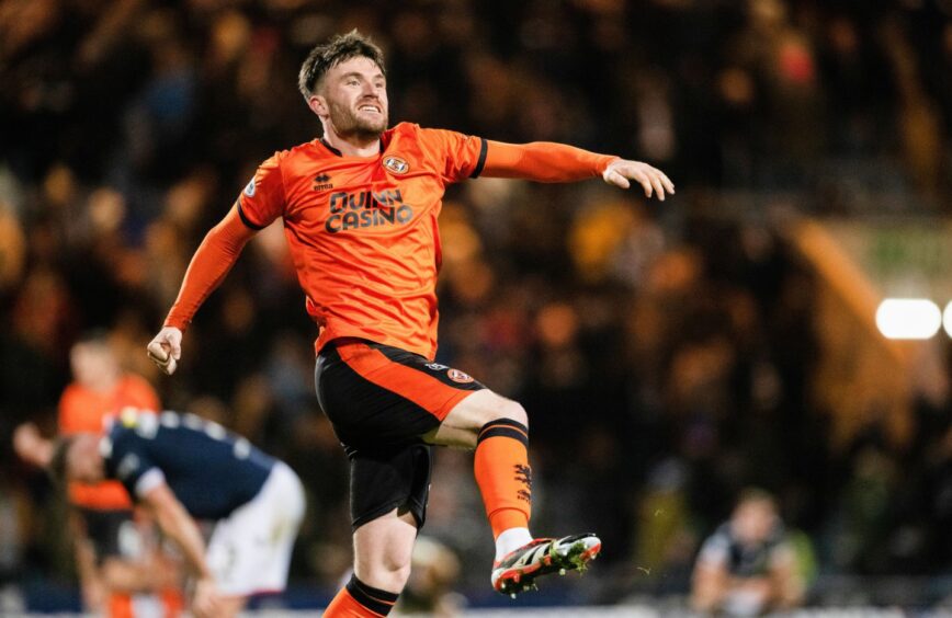 Ryan Strain jumps for joy following Sam Dalby's last-gasp Dens Park winner