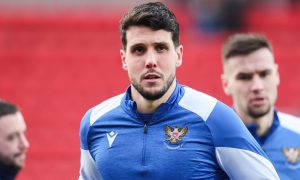 Jack Sanders warms up before a St Johnstone game.