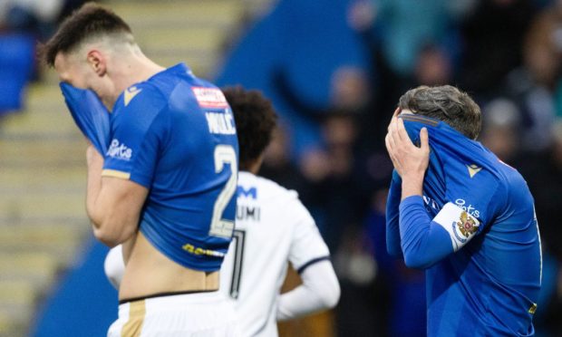 St Johnstone's Bozo Mikulic (left) and Nicky Clark after Saints conceded one of the goals.