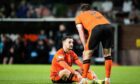 Dundee United's Vicko Sevelj takes to the turf against Hearts. Image: SNS