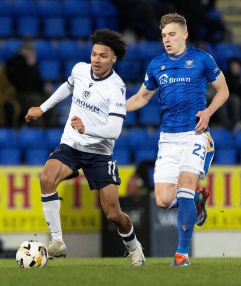 Dundee's Oluwaseun Adewumi is closed down by St Johnstone's Sven Sprangler.