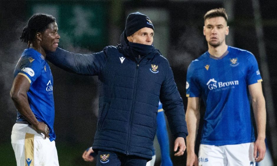 St Johnstone's Aaron Essel, head coach Simo Valakari and Bozo Mikulic look shocked at what's happened in the game against Dundee.