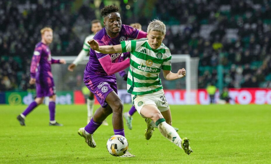 Richard Odada struggles to contain Celtic's Maeda