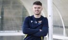 St Johnstone forward Josh McPake leans on a post for a photocall.