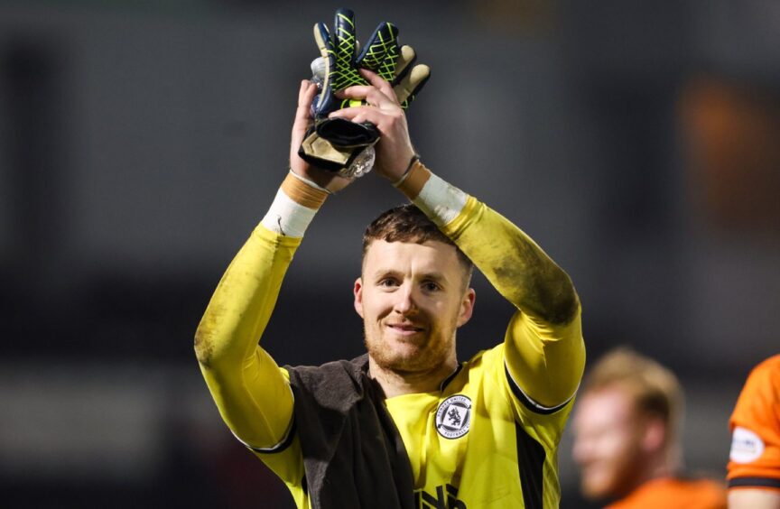 Jack Walton salutes the raucous United fans.