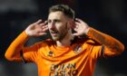 Louis Moult encourages the Dundee United fans to sing his song.