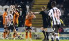 The United players are left stunned as whistler Dickinson points to the spot