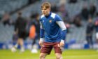 St Johnstone starlet, Fran Franczak, warming up at Ibrox.