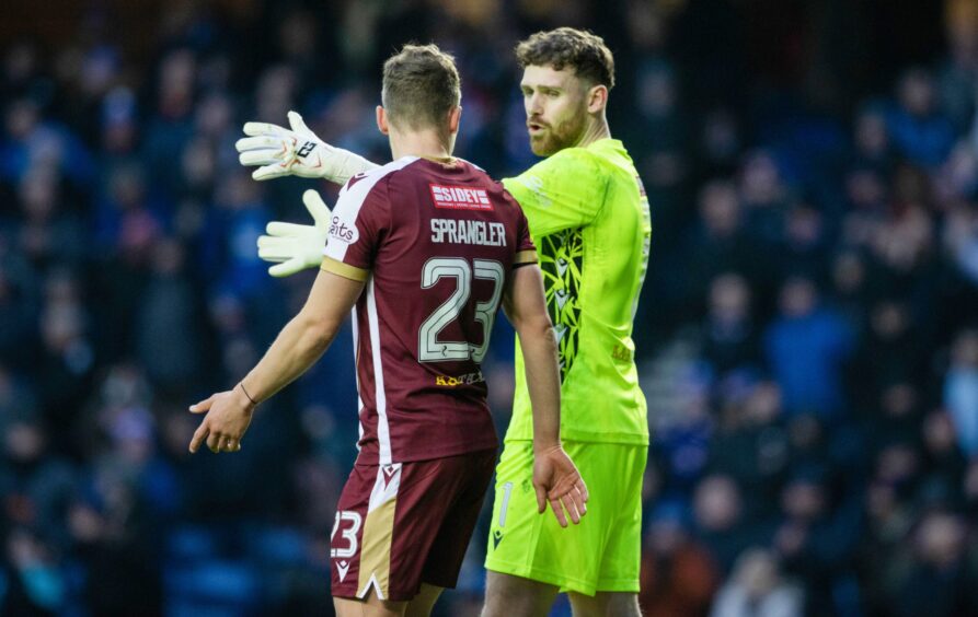 Andy Fisher speaks to Sven Sprangler during St Johnstone's defeat to Rangers. 