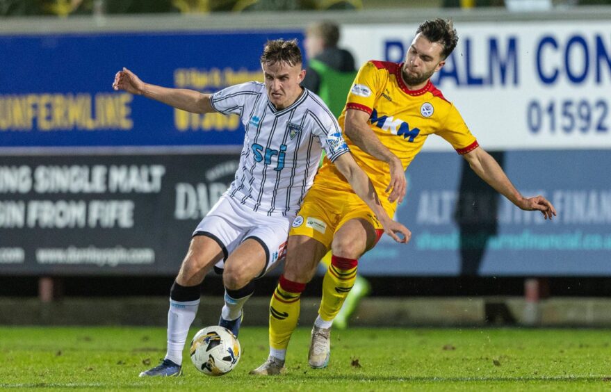 Dunfermline's Matty Todd battles for possession against Ayr United.