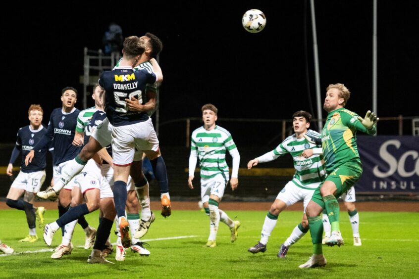 Aaron Donnelly powers Dundee into the lead with his first goal for the club. Image: Paul Devlin/SNS