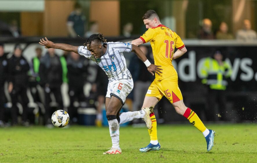 Ewan Otoo holds off Ayr United's Jake Hastie.