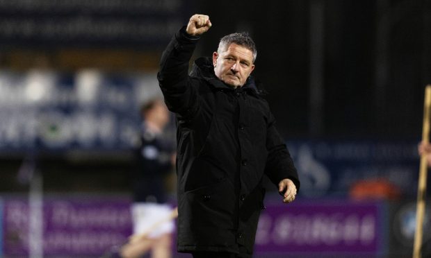 Dundee boss Tony Docherty salutes Dens Park fans after an impressive performance against Celtic. Image: Craig Foy/SNS