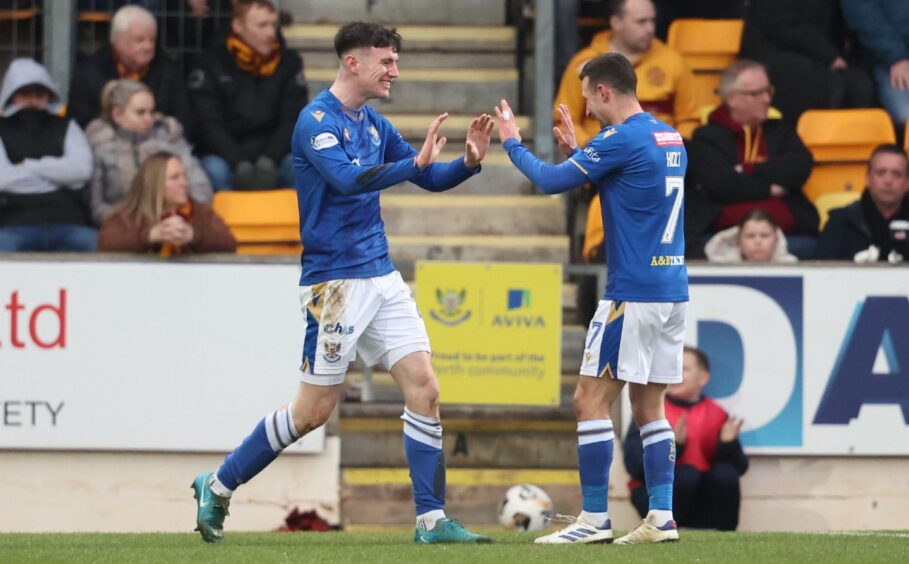 Jason Holt celebrates with Makenzie Kirk after the striker scored the winning goal against Motherwell. 