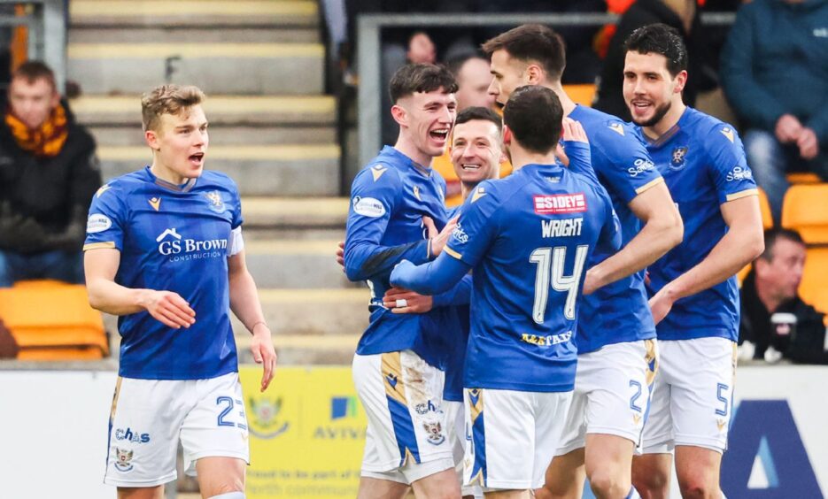 St Johnstone's Makenzie Kirk is congratulated by his team-mates after scoring the winner. 