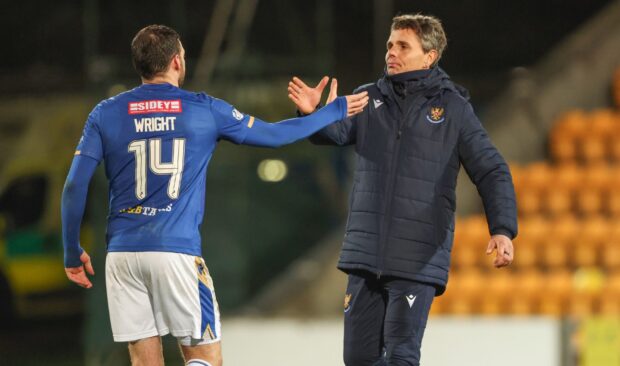 St Johnstone head coach Simo Valakari and Drey Wright celebrate beating Motherwell.