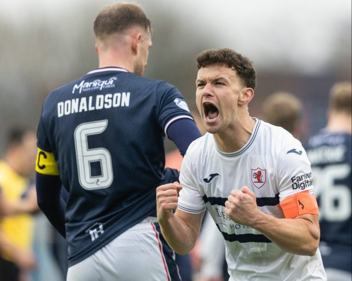 Ross Matthews clenches his fists and roars in celebration after Raith Rovers' victory over Falkirk.