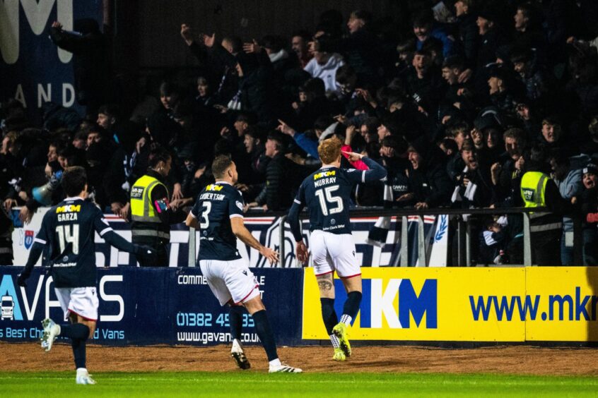 Simon Murray salutes the South Enclosure after opening the scoring. Image: Paul Devlin/SNS