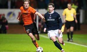 Fin Robertson takes on Dundee United