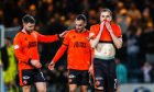 Dundee United United players cut dejected figures at full-time against Dundee