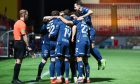 Raith Rovers players huddle round Finlay Pollock to celebrate his opening goal against Hamilton Accies.