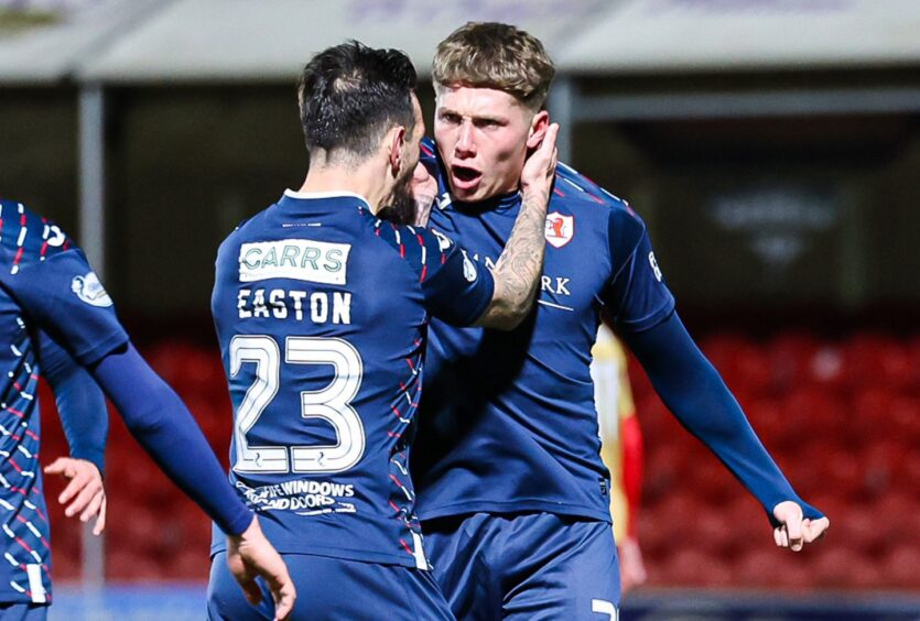 Dylan Easton congratulates Aiden Marsh on his first goal for Raith Rovers.