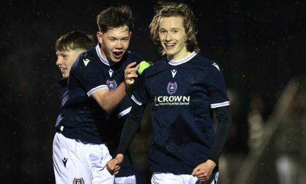 Louis Gray is congratulated by a Dundee team-mate