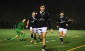 Luca Perrie of Dundee U/18s celebrates after making it 2-0 against Banks O' Dee. Image: David Young