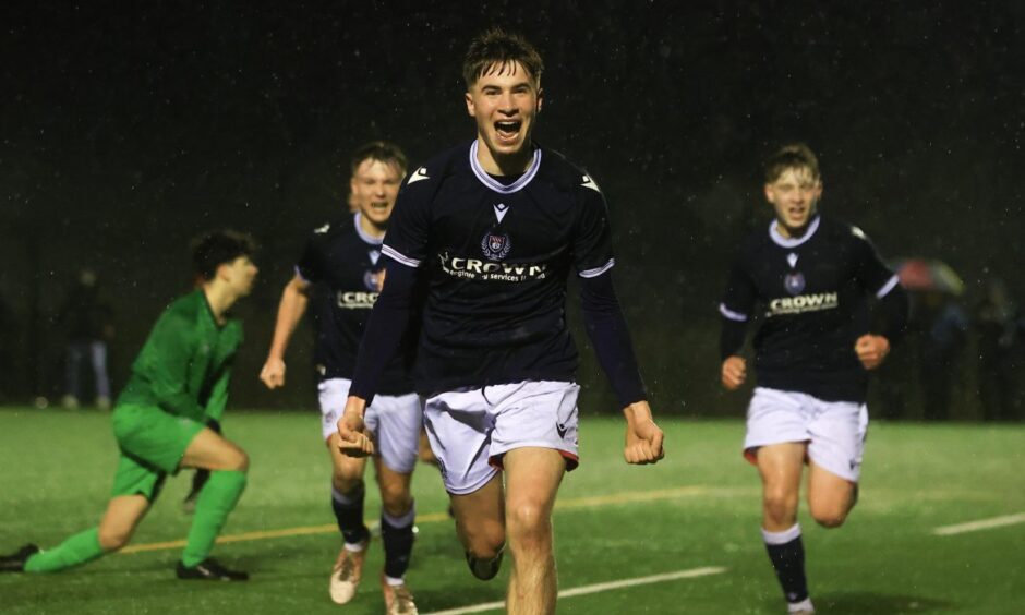 Luca Perrie of Dundee U/18s celebrates after making it 2-0 against Banks O' Dee. Image: David Young