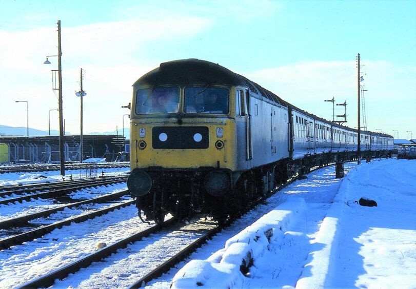 snow on the ground as No 47026 comes into Dundee in 1979.