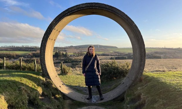 Cheryl in a concrete structure atop St Ninians East, one of our walks near Dunfermline