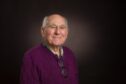 High Henderson portrait. A studio photo of a smiling elderly gentleman.