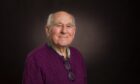 High Henderson portrait. A studio photo of a smiling elderly gentleman.