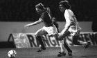 Billy MacKay running with the ball past a defender while playing for Rangers against Valencia in 1979.