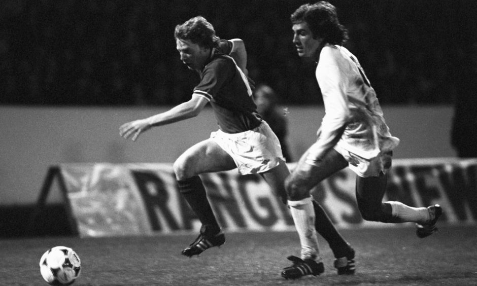 Billy MacKay running with the ball past a defender while playing for Rangers against Valencia in 1979.