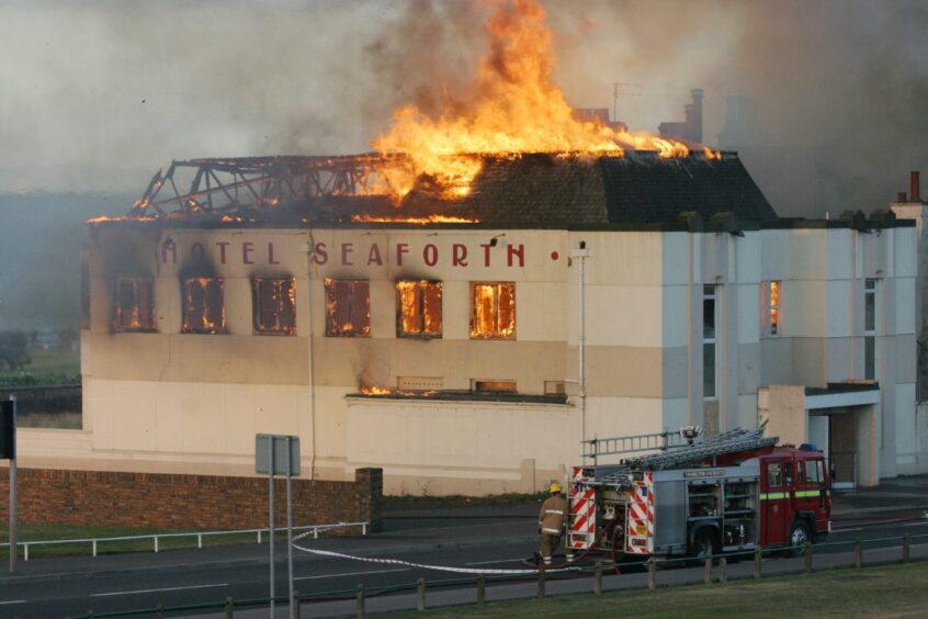 Flames shoot through the hotel roof as the Seaforth goes up in flames in August 2006.