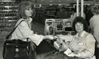 Joanna Lumley paying for her messages at Asda's new store in 1990. Image: DC Thomson.