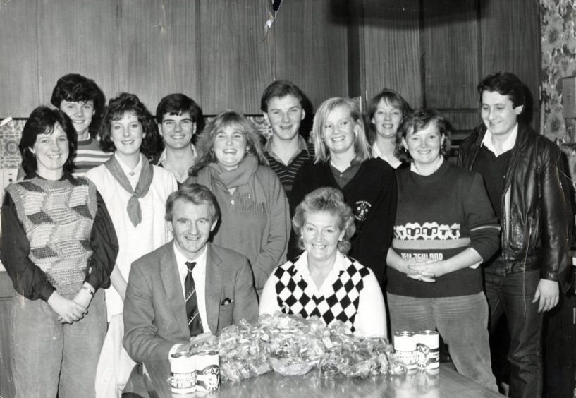 Posing for a picture are some of the helpers who collected the money at Tannadice Park.