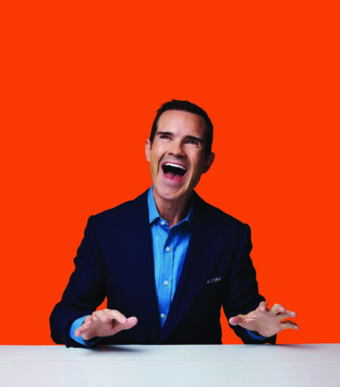 a promotional shot of a smiling Jimmy Carr