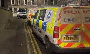 Three police vans on Balmain Street in Montrose.