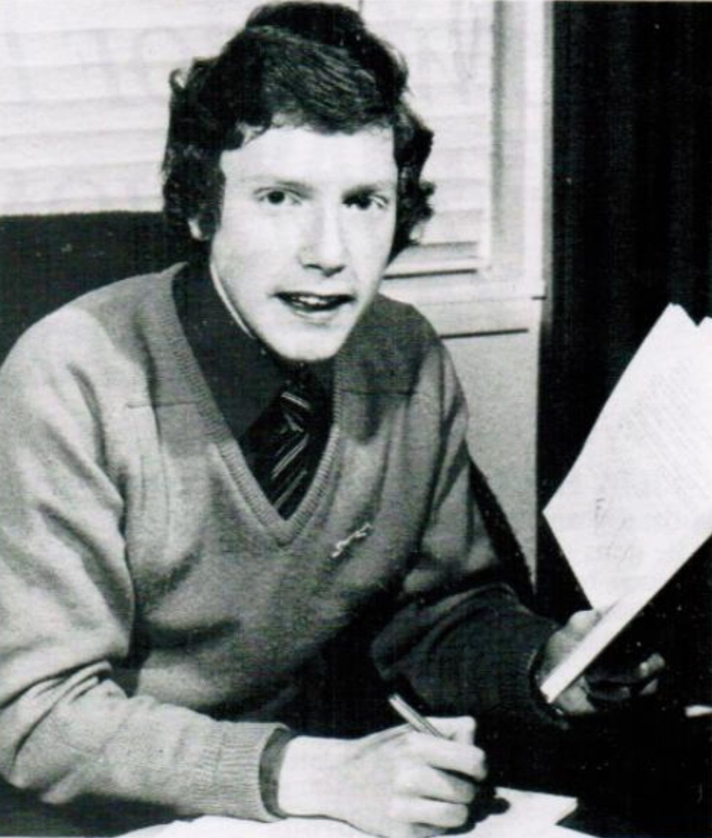 Billy MacKay, with a book and pen in hand, studying in his final year at Auchmuty High School.