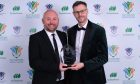 Winner of the Sunday Post Volunteer of the Year John Beatt of Dryburgh Athletic, left, receives his award from Sunday Post deputy editor Thomas Hawkins.
Image: Aimee Todd/Sportpix/SIPA USA