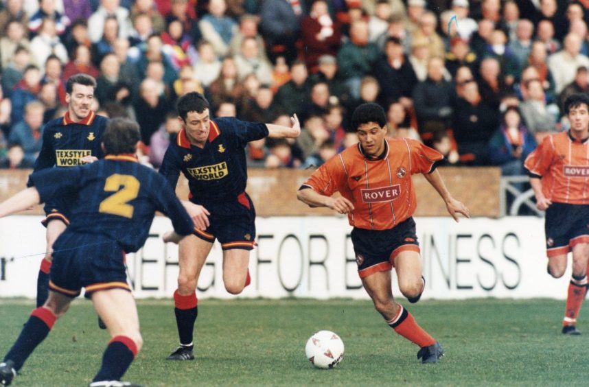 Dundee United's Brazilian forward Sergio runs with the ball against Partick Thistle.