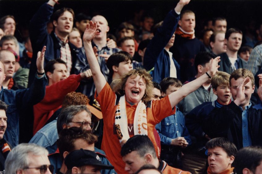 United fans in the stand at Celtic Park