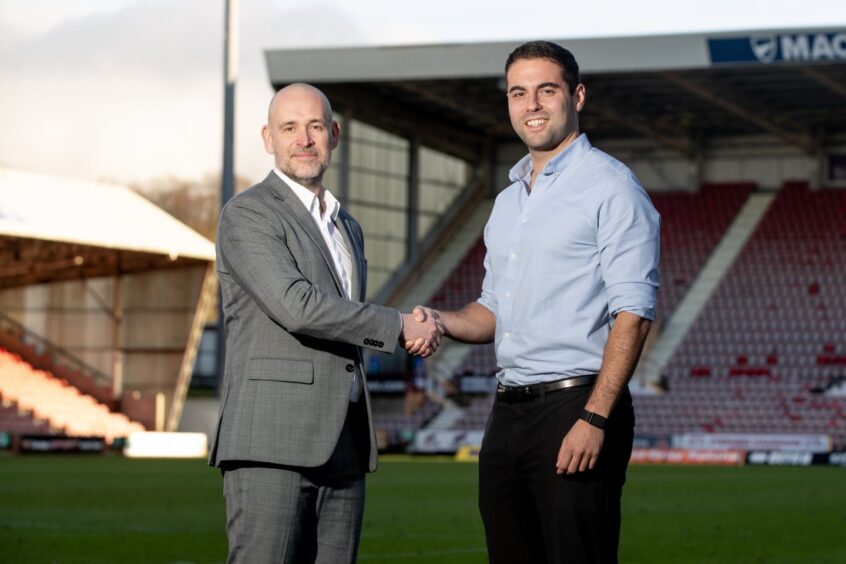 Dunfermline chairman and CEO David Cook shakes hands with Park Bench UK representative Kobi Waterman