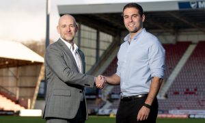 Dunfermline chairman and CEO David Cook shakes hands with Park Bench UK representative Kobi Waterman