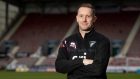 New Dunfermline Athletic head coach Michael Tidser stands with his arms folded at East End Park.